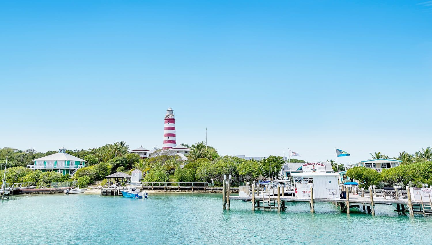 The red-and-white striped Hope Town lighthouse above the harbour on Elbow Cay, Abaco